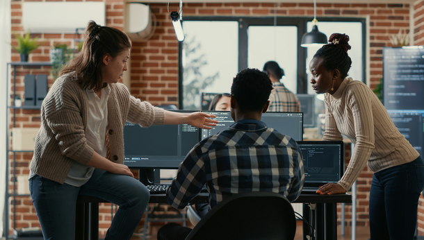 Photo of person at a desk in an office setting