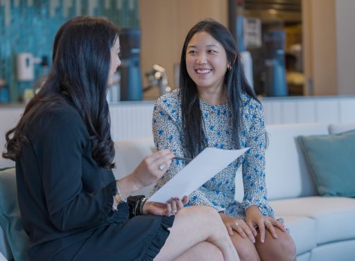 two women talking in office