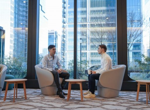 Two people sitting and talking in Point72's Hudson Yards office