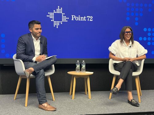 Man and woman speaking on panel