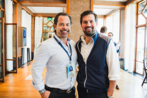 Two men posing for picture
