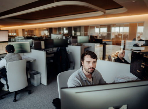 Photo of person at a desk in an office setting